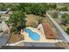 Aerial view of an outdoor community pool surrounded by lounge chairs and recreational buildings at 10040 Sw 93Rd Ct, Ocala, FL 34481