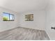 Bright bedroom with hardwood floors, neutral paint, and bright windows at 10040 Sw 93Rd Ct, Ocala, FL 34481
