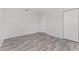 Bright bedroom with hardwood floors, neutral paint, and closet at 10040 Sw 93Rd Ct, Ocala, FL 34481