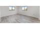 Bright bedroom with hardwood floors, neutral paint and bright windows at 10040 Sw 93Rd Ct, Ocala, FL 34481