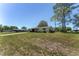 Charming single-story home featuring a covered carport and a well-maintained front yard at 10040 Sw 93Rd Ct, Ocala, FL 34481