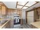 Classic kitchen with bright lighting, wooden cabinets and stainless steel sink at 10040 Sw 93Rd Ct, Ocala, FL 34481