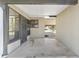 Covered patio leading to storage with convenient access to the backyard at 10040 Sw 93Rd Ct, Ocala, FL 34481