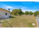 Expansive backyard featuring lush green grass, mature trees, and a fenced perimeter at 10946 Sw 65Th Ave, Ocala, FL 34476