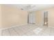 Spacious bedroom with tile flooring, closet, and adjacent bathroom at 10946 Sw 65Th Ave, Ocala, FL 34476