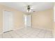 This bedroom has neutral walls, tile flooring, and a large closet with ample storage at 10946 Sw 65Th Ave, Ocala, FL 34476
