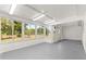 Bright Florida room featuring an abundance of windows, offering natural light and views of the surrounding landscape at 10946 Sw 65Th Ave, Ocala, FL 34476