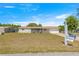 Charming single-story home featuring a screened-in porch, attached garage, and well-maintained front yard at 10946 Sw 65Th Ave, Ocala, FL 34476