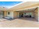 Spacious garage with ample storage, workbench area, and natural light from windows and door to screened porch at 10946 Sw 65Th Ave, Ocala, FL 34476