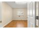 Bright laundry room boasting tile floors, a window with blinds, and ample space for appliances at 10946 Sw 65Th Ave, Ocala, FL 34476