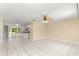 Spacious living area with tile floors, open layout, and easy access to kitchen and outdoor living space at 10946 Sw 65Th Ave, Ocala, FL 34476
