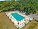 Relax by the community pool with seating and tables, perfect for enjoying sunny days at 10946 Sw 65Th Ave, Ocala, FL 34476
