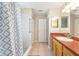 Well-maintained bathroom with tiled floors, walk-in shower, and updated vanity at 11133 Sw 73Rd Ter, Ocala, FL 34476