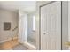 Bathroom featuring a walk-in shower with glass door, tiled floor, and built-in storage at 11133 Sw 73Rd Ter, Ocala, FL 34476