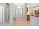 Open entryway with neutral colors, tile flooring, and natural light pouring through front door at 11133 Sw 73Rd Ter, Ocala, FL 34476