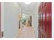 Warm, inviting entryway showcasing tile flooring, leading to a dining area bathed in natural light at 11133 Sw 73Rd Ter, Ocala, FL 34476