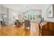 Bright living room featuring hardwood floors, vaulted ceilings and large windows with natural light at 11133 Sw 73Rd Ter, Ocala, FL 34476