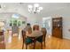 Open floor plan connects living and dining area with lots of natural light and hardwood flooring at 11133 Sw 73Rd Ter, Ocala, FL 34476