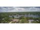 Gorgeous lakefront property featuring a well-maintained home with a spacious yard and scenic views at 11921 Se 169Th Avenue Rd, Ocklawaha, FL 32179