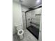 Modern bathroom featuring a glass-enclosed shower with sleek black hardware at 11921 Se 169Th Avenue Rd, Ocklawaha, FL 32179