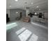 Open concept living room with modern flooring and design at 11921 Se 169Th Avenue Rd, Ocklawaha, FL 32179