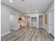 Open-concept living room featuring new flooring, neutral paint, and an opening to the kitchen, offering an inviting atmosphere at 1325 42Nd St, Orlando, FL 32839