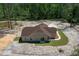 Aerial view of home with new lawn and landscaped edge, nestled in the woods at 13491 E Hwy 316, Fort Mc Coy, FL 32134