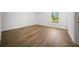 Bedroom with vinyl flooring, white walls, and a window at 13491 E Hwy 316, Fort Mc Coy, FL 32134