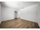 Spacious bedroom showcasing hard flooring, white walls, and closet in view at 13491 E Hwy 316, Fort Mc Coy, FL 32134