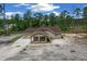 Charming one-story home featuring a covered entrance and a well-maintained lawn at 13491 E Hwy 316, Fort Mc Coy, FL 32134