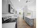 Open kitchen featuring stainless steel appliances, an island, and a seamless transition to the dining area at 13491 E Hwy 316, Fort Mc Coy, FL 32134
