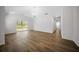 Bright living room featuring wood flooring, vaulted ceilings and sliding doors to the backyard at 13491 E Hwy 316, Fort Mc Coy, FL 32134