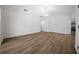 Spacious living room with wood-look floors, and modern lighting fixtures at 13491 E Hwy 316, Fort Mc Coy, FL 32134