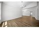 Well-lit living room with wood-look floors and views of the kitchen at 13491 E Hwy 316, Fort Mc Coy, FL 32134
