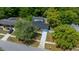Aerial view of single-Gathering home with screened pool, fenced yard, mature trees and a painted driveway at 14476 Sw 43Rd Court Rd, Ocala, FL 34473