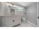 Bathroom with gold fixtures, a walk-in shower, and a single sink vanity with drawer storage at 14476 Sw 43Rd Court Rd, Ocala, FL 34473