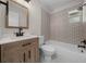 Bathroom has a modern vanity, updated shower-tub combo, and decorative tiles at 14476 Sw 43Rd Court Rd, Ocala, FL 34473