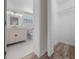 This bathroom features a walk-in closet, toilet, vanity and tiled flooring at 14476 Sw 43Rd Court Rd, Ocala, FL 34473