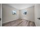 The bedroom has wood-look flooring, a window and fresh white walls at 14476 Sw 43Rd Court Rd, Ocala, FL 34473