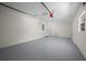 Spacious two car garage has epoxy flooring, a window and a garage door opener installed at 14476 Sw 43Rd Court Rd, Ocala, FL 34473
