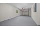 Spacious garage with sealed flooring, an automatic door opener, and a window that allows some natural light at 14476 Sw 43Rd Court Rd, Ocala, FL 34473