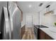 Contemporary kitchen with stainless steel appliances, quartz countertops and brown wood cabinets at 14476 Sw 43Rd Court Rd, Ocala, FL 34473
