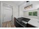 Kitchen with stainless steel oven, quartz countertops, and modern hanging light fixtures at 14476 Sw 43Rd Court Rd, Ocala, FL 34473
