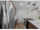 Contemporary kitchen with stainless steel appliances, quartz countertops and brown wood cabinets at 14476 Sw 43Rd Court Rd, Ocala, FL 34473