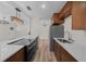 Well-lit kitchen featuring wood cabinets, stainless steel appliances, and sleek countertops at 14476 Sw 43Rd Court Rd, Ocala, FL 34473