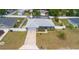 Lovely home featuring a fenced backyard, screened-in pool and spacious yard with mature landscaping at 1453 Ne 161St Pl, Citra, FL 32113