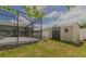 A screened in pool and backyard storage shed at 1453 Ne 161St Pl, Citra, FL 32113