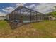 Fenced-in backyard featuring a pool with screened enclosure, plus a storage shed in the distance at 1453 Ne 161St Pl, Citra, FL 32113