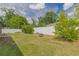 A fenced in backyard with a fire pit and green grass at 1453 Ne 161St Pl, Citra, FL 32113