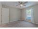 Comfortable carpeted bedroom featuring neutral-colored walls and overlooking the gorgeous pool at 1453 Ne 161St Pl, Citra, FL 32113